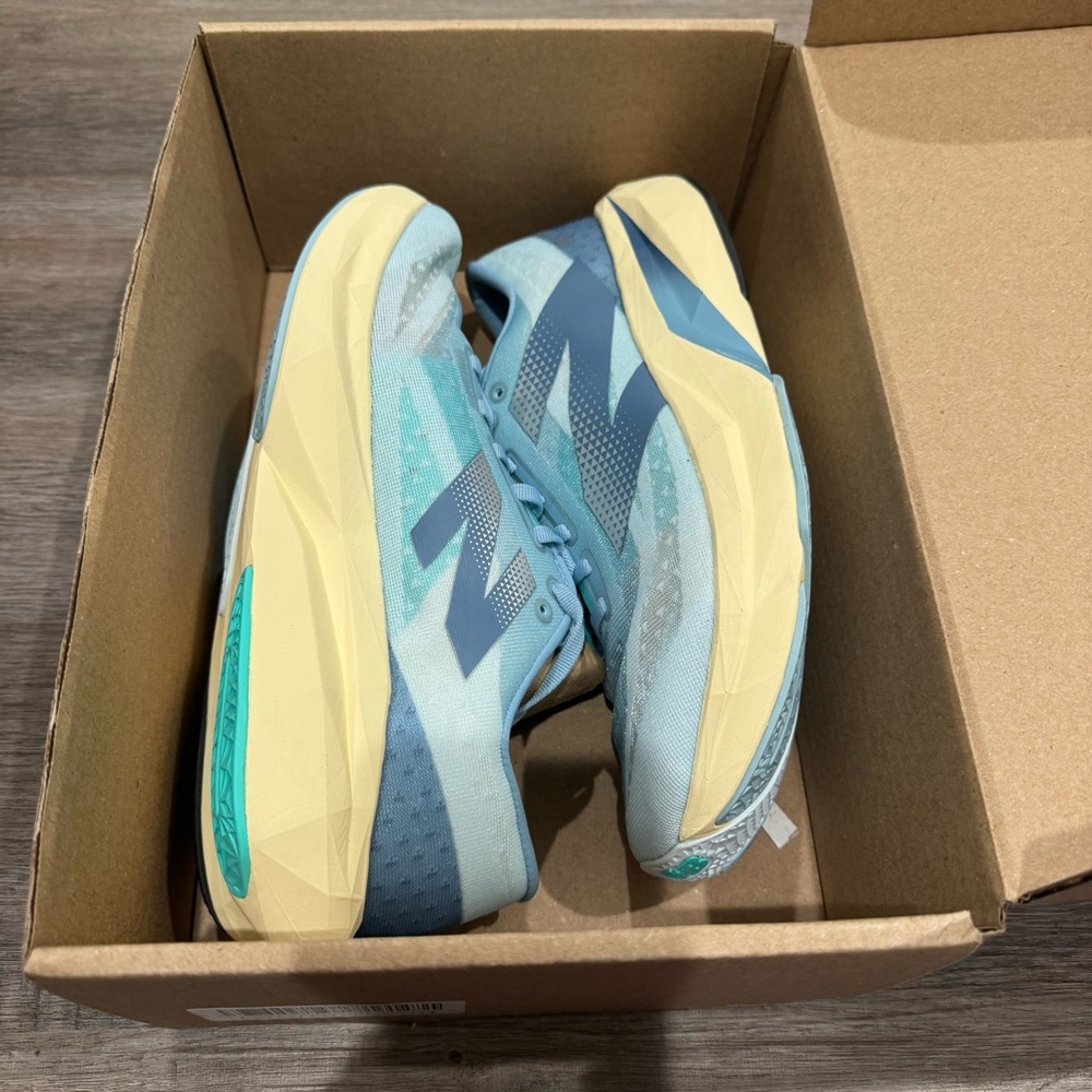 New Balance Fuel Cell Rebel V4 Quarry Blue Chrome Heron Blue Athletic Sneakers - Picture 11 of 12